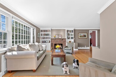 Living room bursting with natural sunlight, hardwo