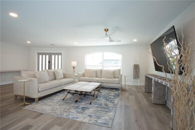 Inviting living room. Canned lighting throughout w