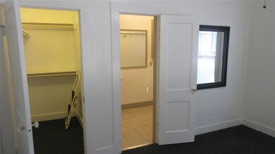 View of closet and bathroom