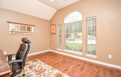Working from home is a breeze in this Oversized Study with a view of the front yard.