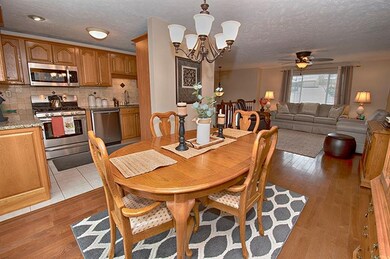 Open floor plan with hardwood floors throughout
