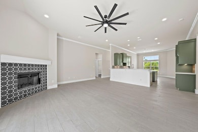 Unfurnished living room with ornamental molding, 