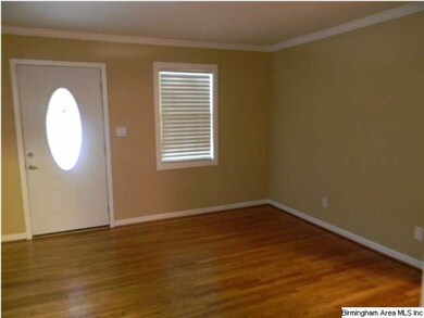 living room freshly painted and nice hardwood floo