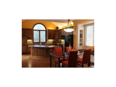 Large Granite Island with Gas Stove Graces the Ove