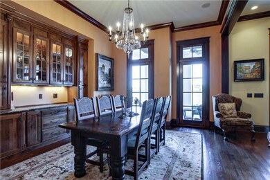 Spacious formal dining with built in cabinetry 