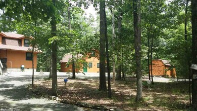 Distant front showing house and guest apartment