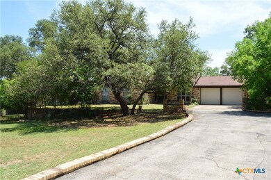 Asphalt Driveway Leading to the Two Car Garage ~ T
