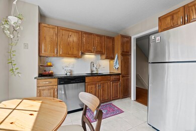 Refurbished kitchen has granite countertops and al