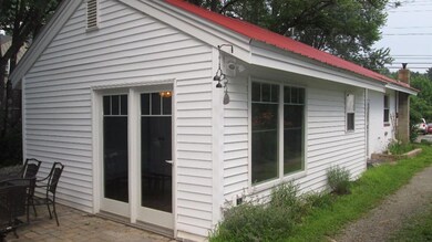 Rear of home, vinyl siding, metal roof