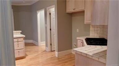 Jenn Air gas cooktop. First door to the right is t