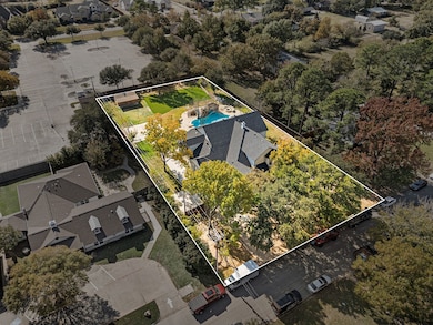 Aerial perspective of suburban area featuring property boundaries highlighted