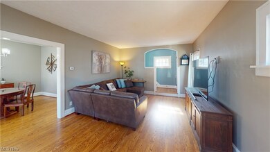 Living room with light hardwood / wood-style floors