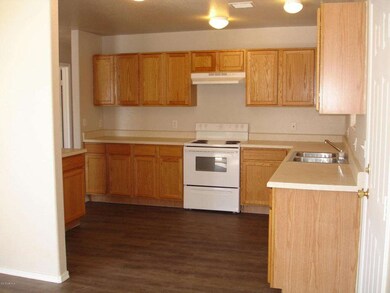 Kitchen showing stove & sink