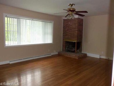 Living Room. Step inside and you will find a spacious living room with REAL WOOD FLOORS, corner fireplace with gas logs, ceiling fan and notice all the natural light you will get with the REPLACEMENT Windows!