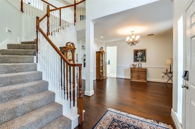 Entryway featuring ornamental molding, a high ceil