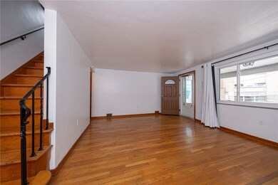 Large picture window and hardwood floors.