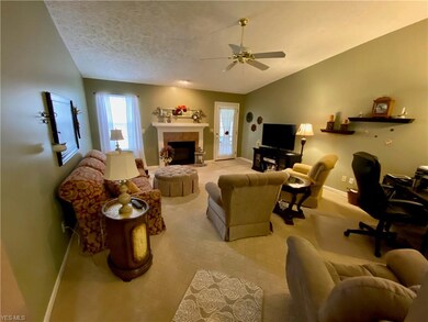 Large Great Room with gas fireplace.  Door to the 
