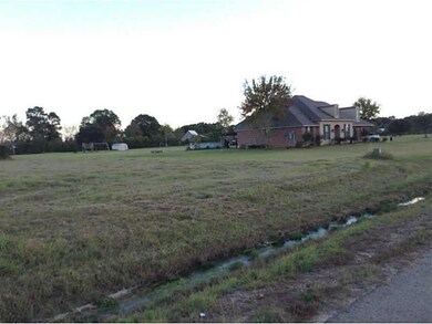 Photo. This view of lot shows a neighboring house.