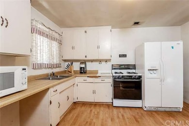 The large kitchen has abundant storage and a brigh