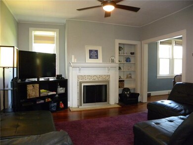 The hardwoods, built-ins, fireplace, and trim add 