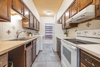 Kitchen looks narrow but there are options. Move t