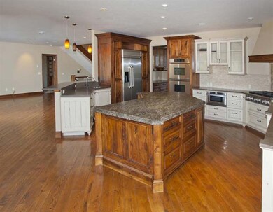 Chef's kitchen with custom walnut cabine
