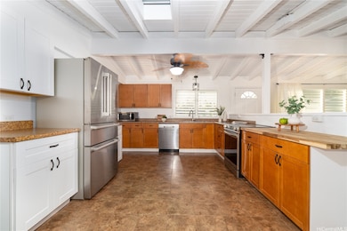 Kitchen has a door that leads straight into the carport.