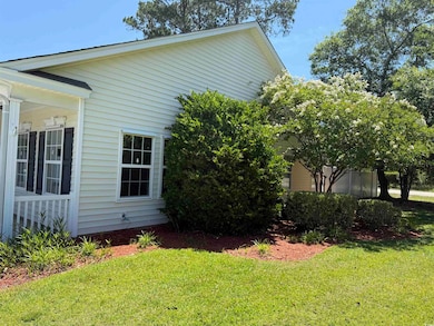 View of property exterior featuring a yard