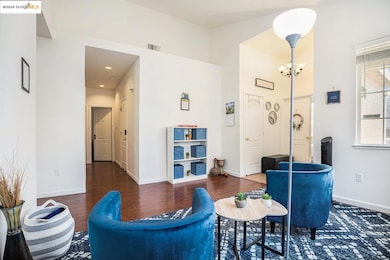 Living room with wood finished floors and a chandelier
