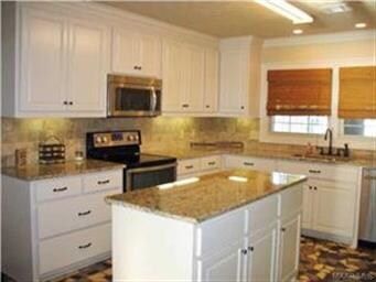 Updated kitchen with island and great pantry.
