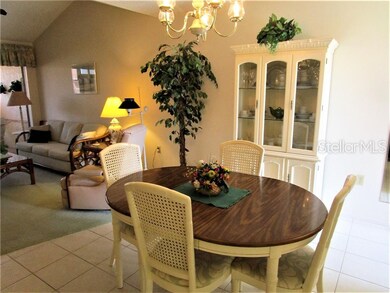 Dining area has tiled flooring and is open to Kitc
