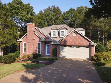 Lots of extra parking space in this extra wide, aggregate driveway. The 2-car garage is wired/powered for an electric car charger.