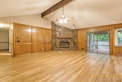 Greatroom with Corner Stone Woodburning Fireplace