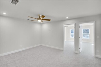 Spare room with light colored carpet, recessed lighting, and ceiling fan