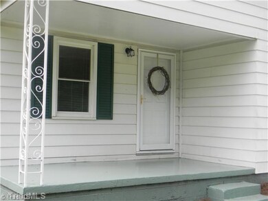 Exterior Front. Just Pressure Washed and Older Landscaping Removed Gives This Cute Cottage a Fresh Start!