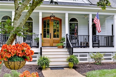 View of exterior entry with a porch