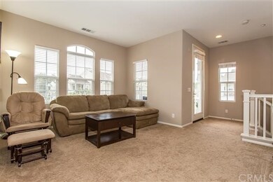 Very spacious living room has natural light and a 