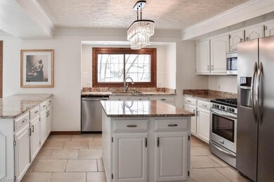 The kitchen has stainless steel appliances and 18x