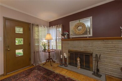 Stone fireplace, corner window and access to back 