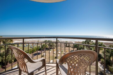 Balcony with view of water and beach