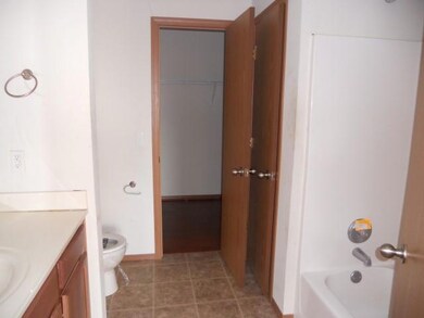 Master bath with large walk in closet