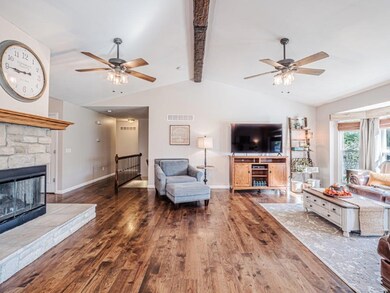 Vaulted Great Room with wide plank hickory hardwoo