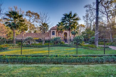 This fence surrounds the property, with two automatic gates on this circular driveway.