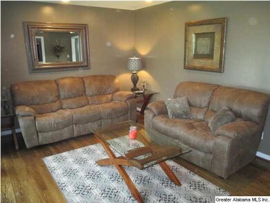 Living room. Refinished hardwood.