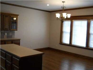 Newly refinished wood floor in kitchen/dining area