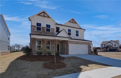 View of front of property with brick siding, an at