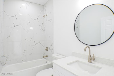 Full bathroom featuring vanity, tiled shower / bat