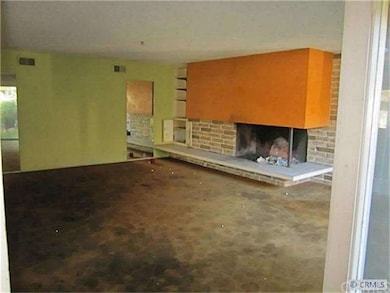 Inviting fireplace centers the living room.