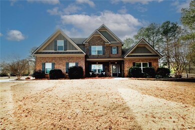 Craftsman-style home with brick siding and board a