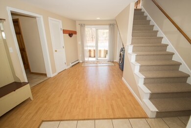 Enter into this bright spacious mudroom with laund